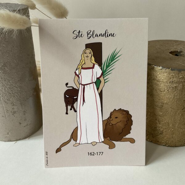 Image de sainte Blandine représentée avec la palme du martyr, le lion et le taureau. Imprimée au format A6 sur du papier 300g.
